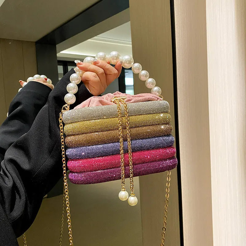 Women's round crossbody bag in soft PU with beaded details, adjustable strap, and zippered interior organiser.