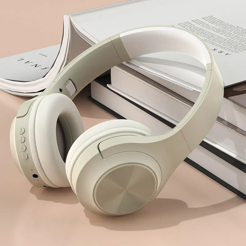Wireless Bluetooth headset with creative design in ivory white colour, showing head-mounted wearing style