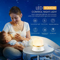 White bedside nursing night light with touch controls for dimming and colour selection.
