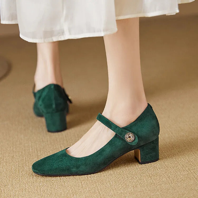 Black suede women's Mary Jane shoes with a chunky heel and square toe on a plain background.