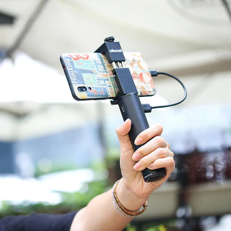 Black portable power bank with integrated handle showing 12.5cm length and 3.2cm width dimensions