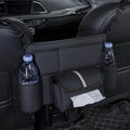 Black leather car seat hanging organiser with tissue box between vehicle seats
