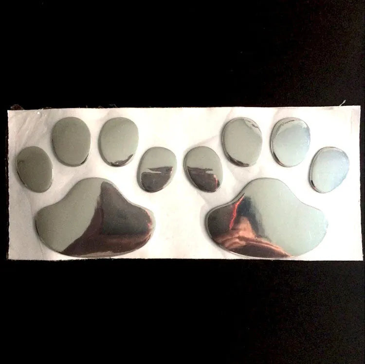 PVC footprint sticker 60x60mm with chrome finish and adhesive back, shown in silver, gold, red or black.