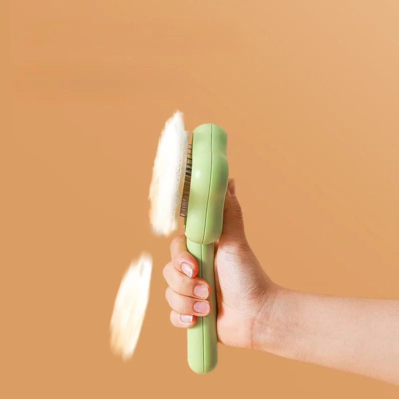 Green cat grooming comb with stainless steel needles and self-cleaning feature, 20cm length