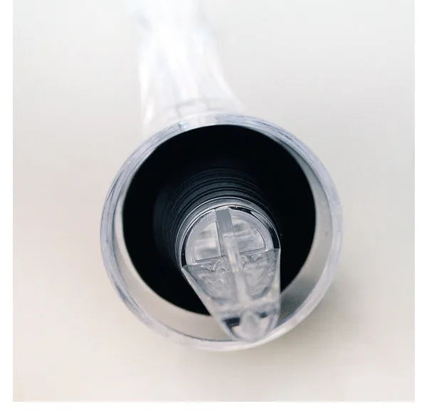 Wine aerator with stainless steel filter, measuring 16cm in length and 4.2cm in diameter, on a glass with red wine.