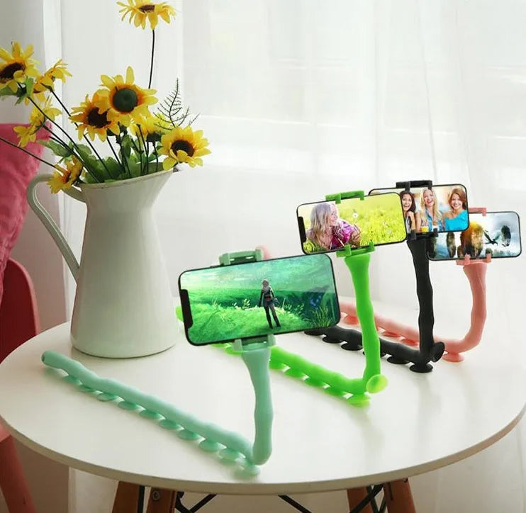 Black flexible phone holder with 62cm gooseneck arm and silicone bracket on a desktop