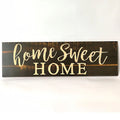 Wooden wall hanging ornament with carved design measuring 40cm by 12cm