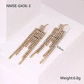 Gold-colour stainless steel earrings with heart and star tassel designs on a white background.