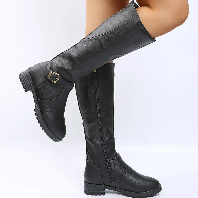 Women's black knight high boots with a square heel and a front belt buckle detail on a round toe.
