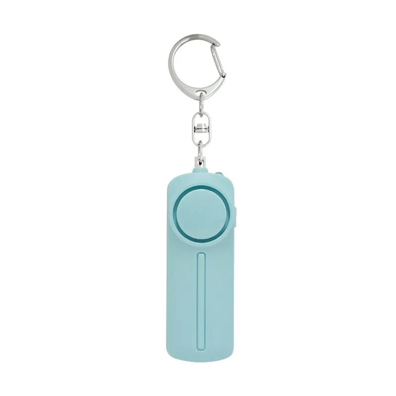 Compact pink self-defence alarm showing 86mm length with activation button and LED light
