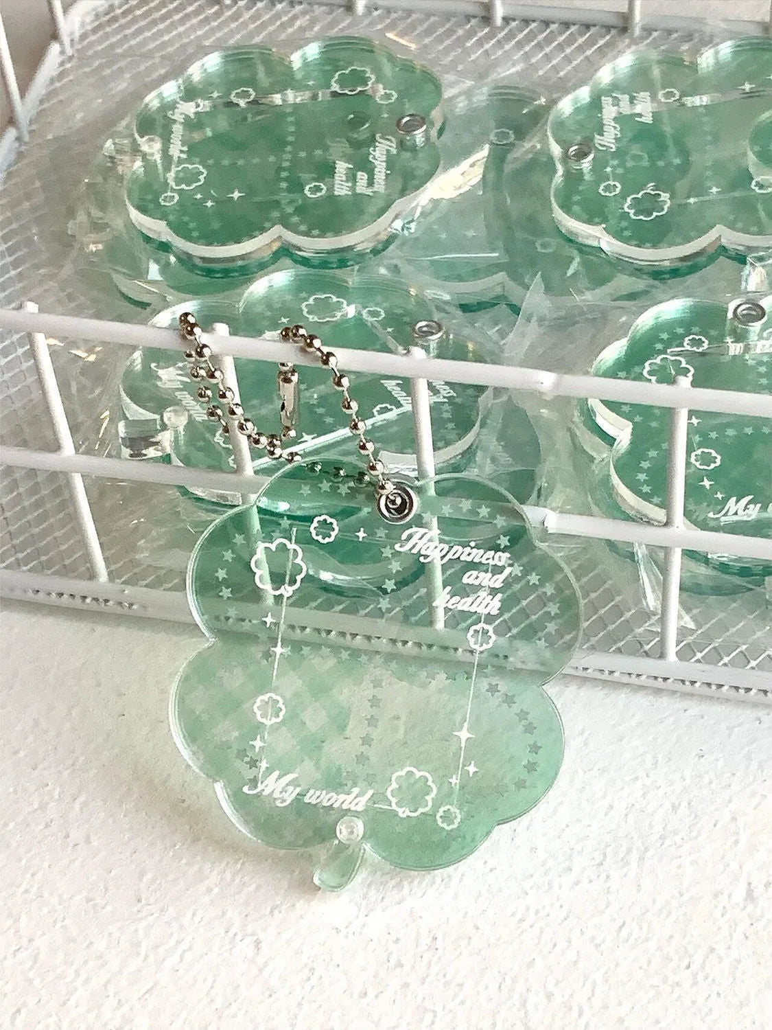 Blue, green, and mint green four-leaf clover acrylic phone pendant keychain.