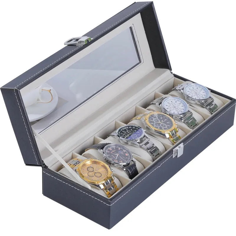 Grey leather watch storage box with see-through lid showing watch compartments