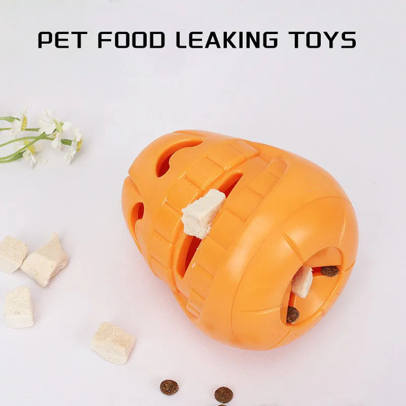 Orange Halloween pumpkin-shaped dog toy with textured surface and treat-dispensing funnel opening