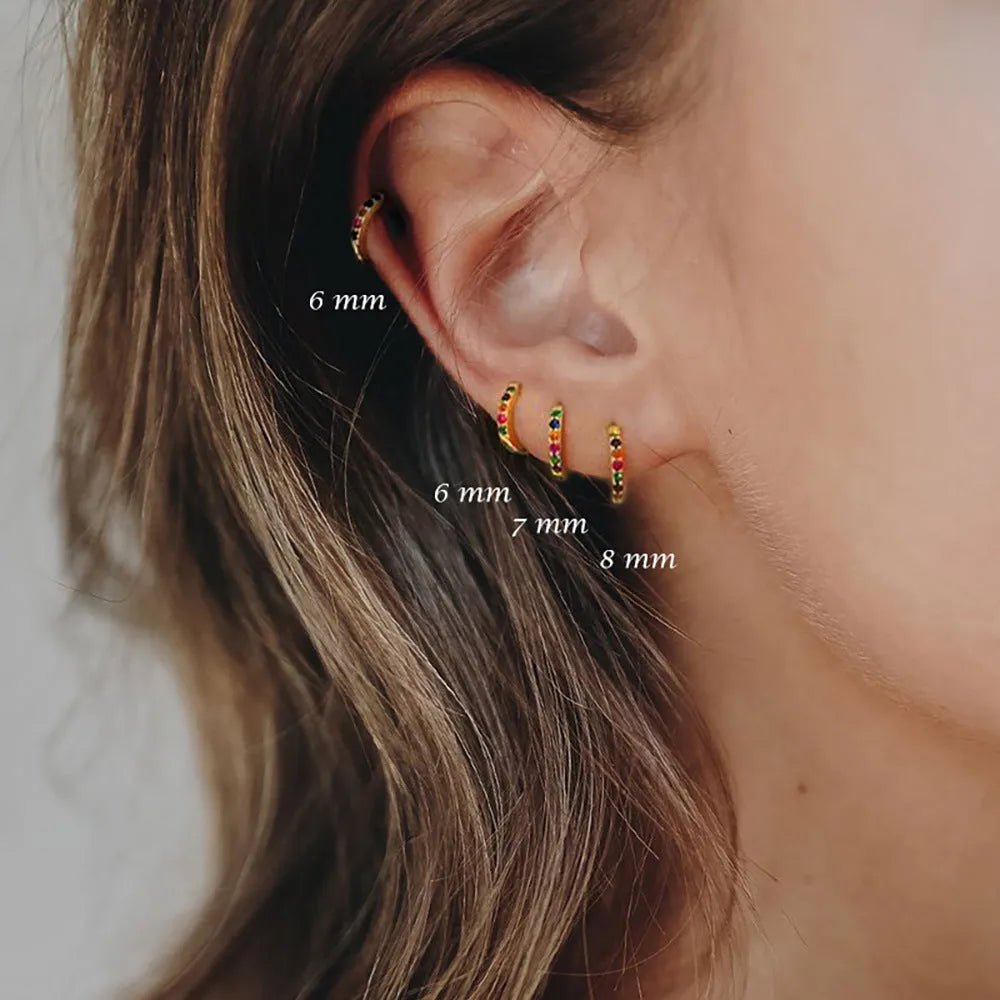Circle zircon perforated stud earrings in gold, rose gold, silver colours with geometric design