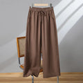 Women's straight-leg casual trousers with elastic waistband and lace-up detail in apricot colour