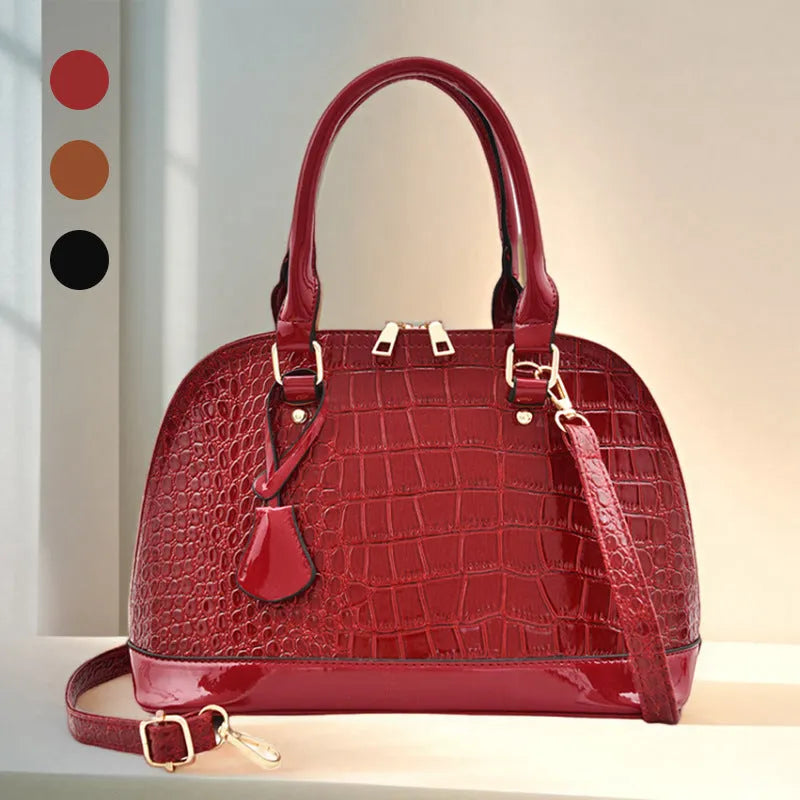 Large shiny crossbody shoulder bag with shell shape design showing 22x30x15cm dimensions