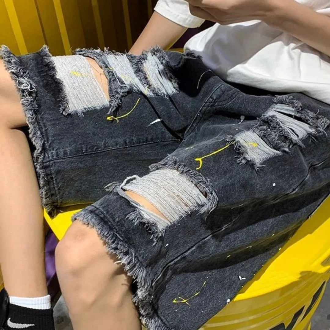 Men's loose fit water washed hole denim shorts in black and light blue colours, fifth pants length cut