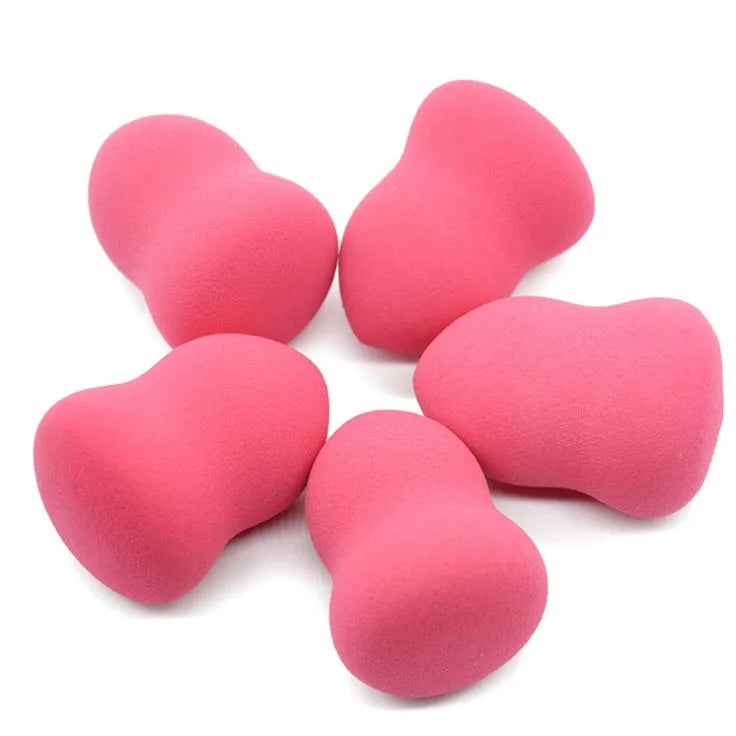 Pink hydrophilic non-latex makeup sponge measuring 4x4x5.6 cm with soft Q elastic texture for foundation application.