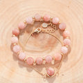 Women's double-layer copper bracelet with gold plating, strawberry quartz crystals, and lucky beads.