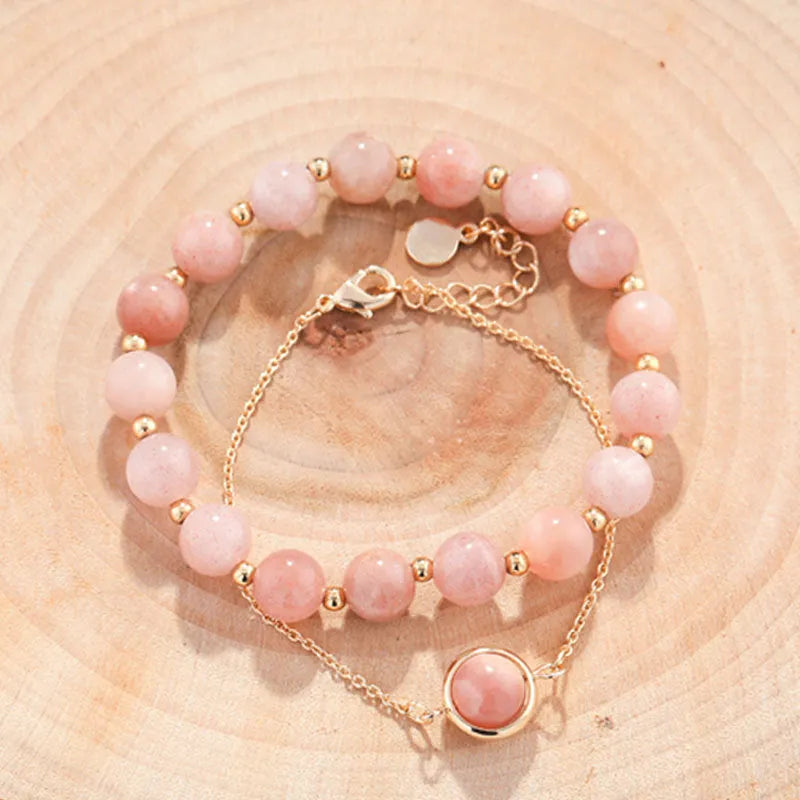Women's double-layer copper bracelet with gold plating, strawberry quartz crystals, and lucky beads.