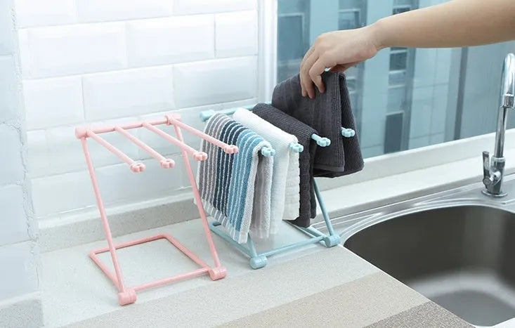 Foldable plastic dishcloth shelf in light blue with vertical towel storage