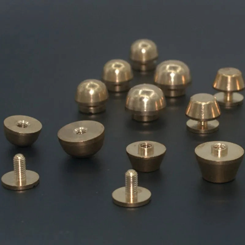 Brass decorative buckle for footwear showing 10x6mm and 12x7mm sizes in round and geometric shapes