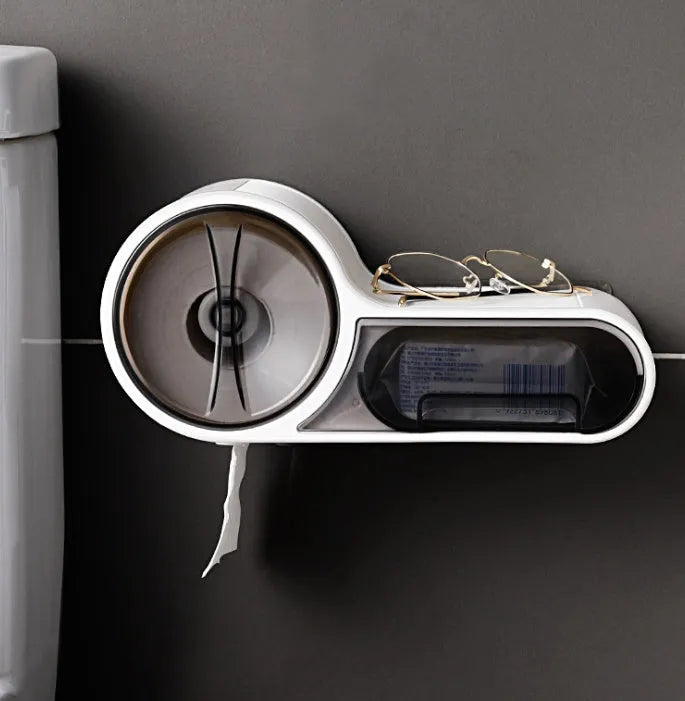 White plastic free-standing toilet roll holder with a curved design on a bathroom surface.