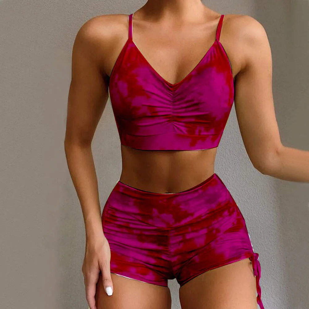 Tie-dye bikini shorts suit with push-up Brazilian top, nylon outer, polyester lining, light green or purple, sizes S to L.