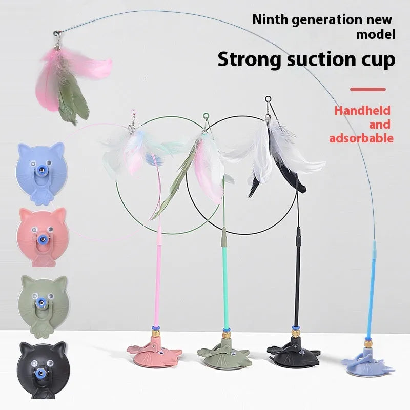 Cat teaser wand with suction cup base mounted on window featuring coloured cat face attachment