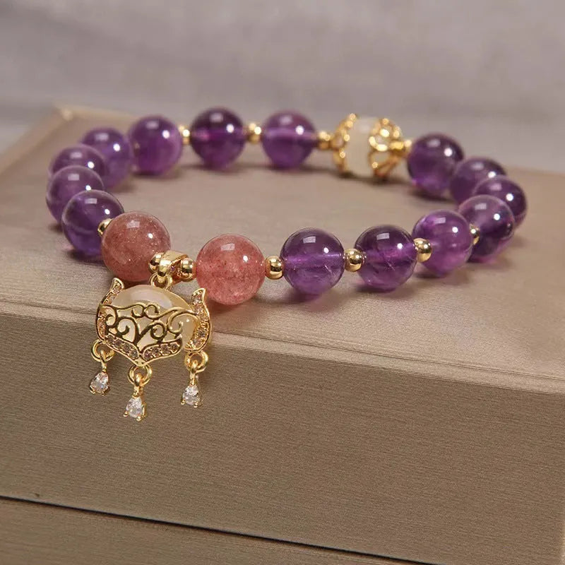 Women's longevity lock bracelet with natural amethyst crystals and gold-plated safety lock charm