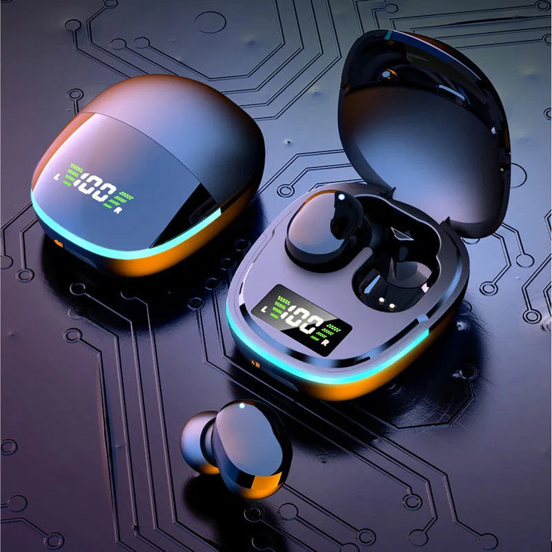 Black true wireless Bluetooth headphones with charging box showing digital battery display and three pairs of different sized ear caps