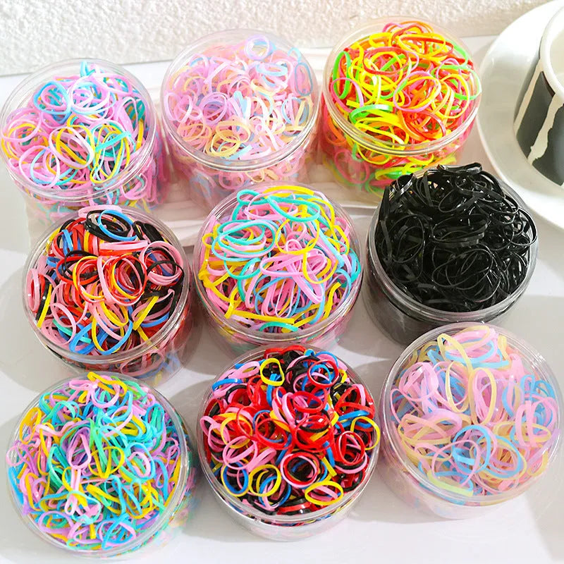 Multicoloured TPU baby hair ties in a reusable plastic container, pack of 300 or 600.