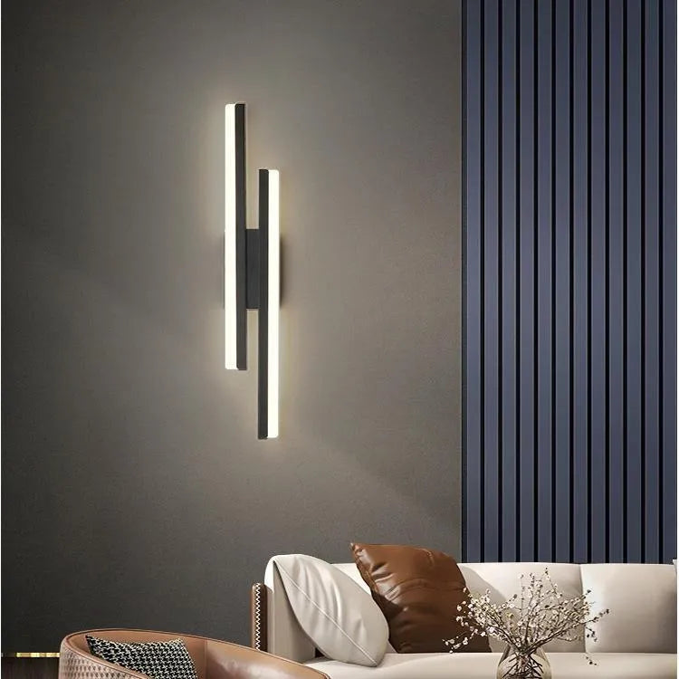 Scandinavian minimalist LED wall light with 500mm acrylic lampshade in black finish mounted on white wall