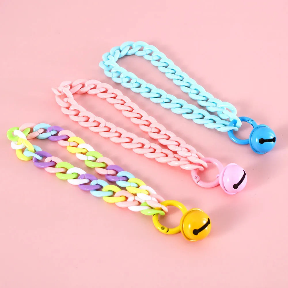 Adjustable pet collar in macaron candy colours with plastic construction and monochrome pattern