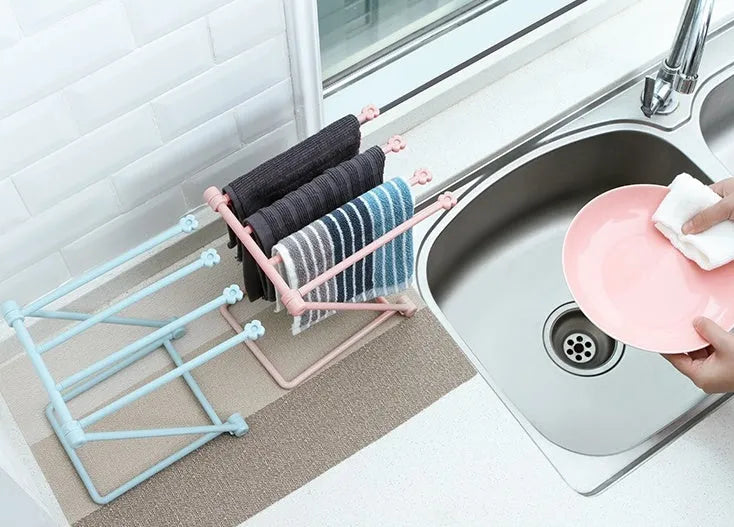 Foldable plastic dishcloth shelf in light blue with vertical towel storage
