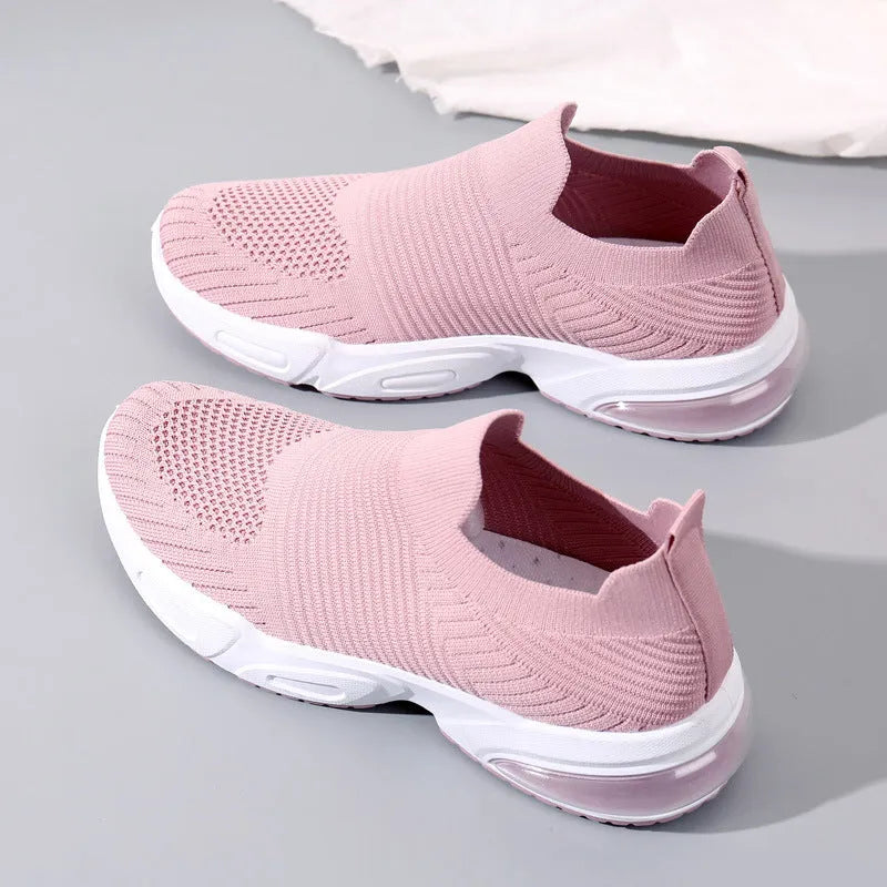 Slip-on sock shoes with mesh lining and PVC sole in black, white, pink, and khaki colours