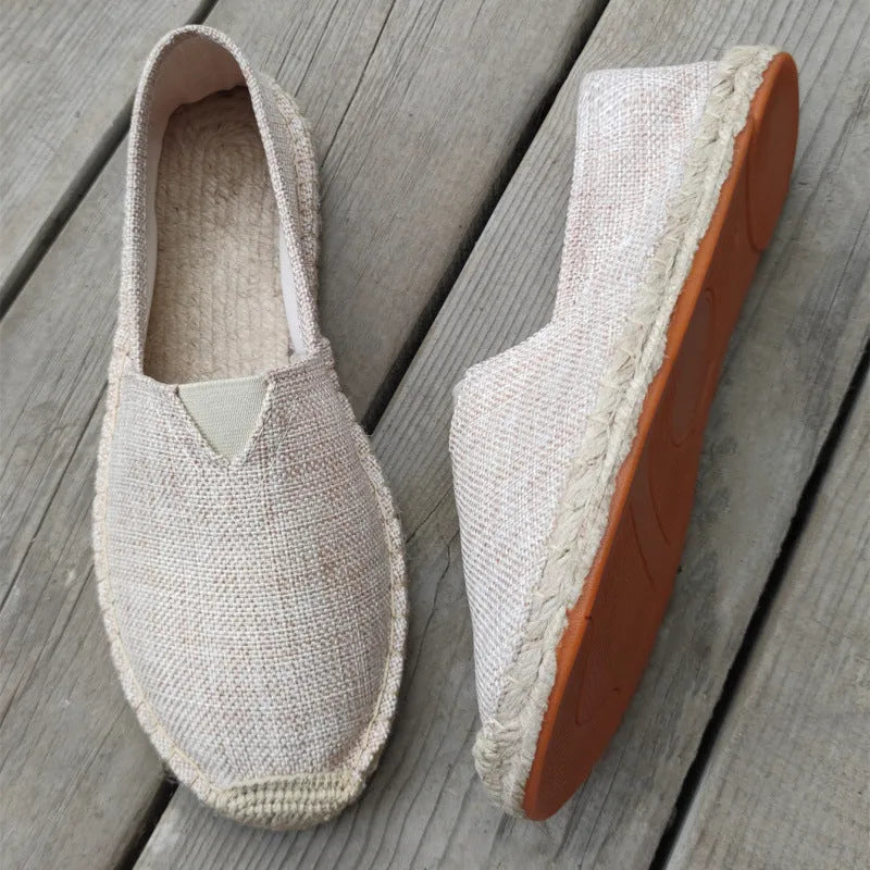 Men's solid-colour canvas casual shoes with round toe in various colours on a plain background.