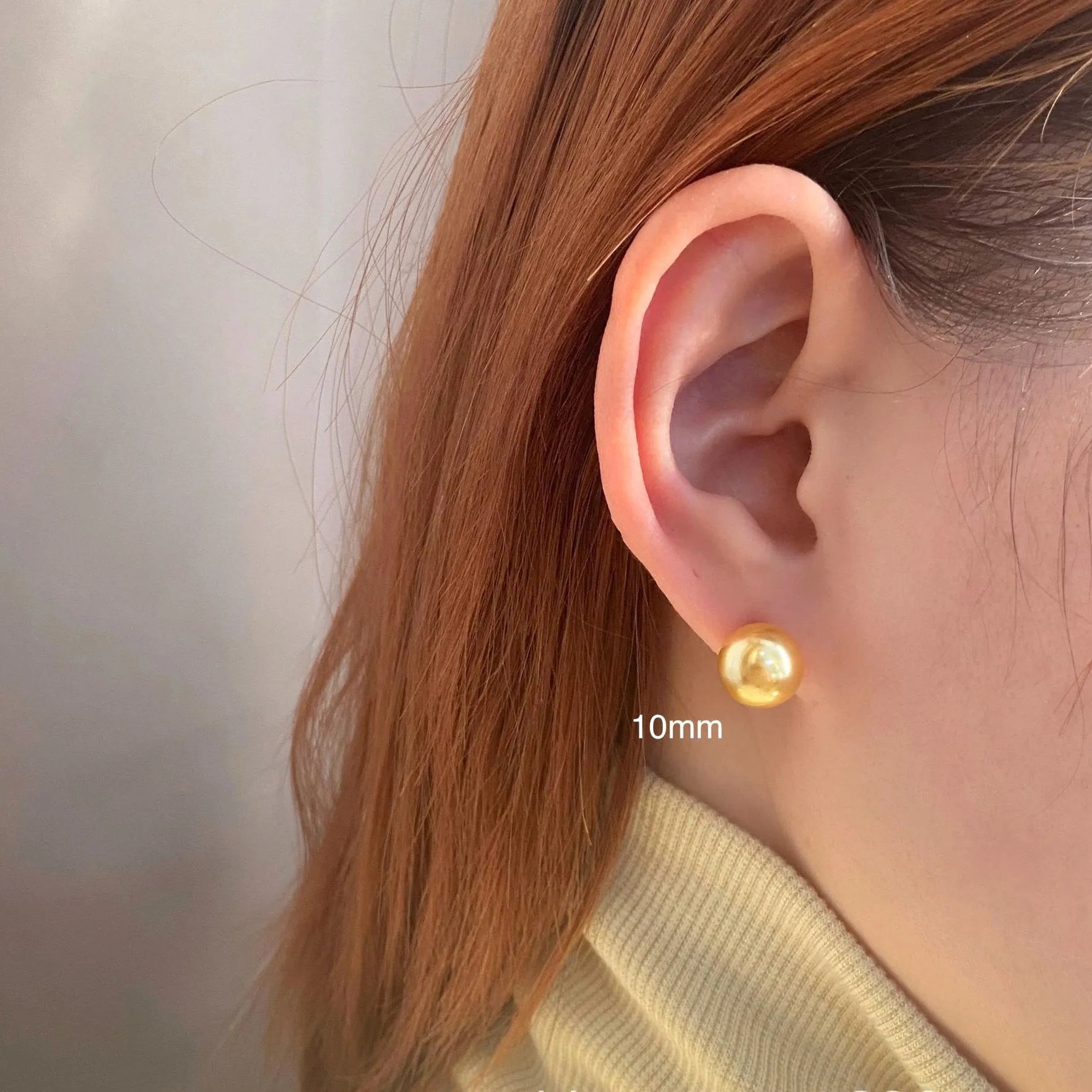 Large pearl stud earrings with geometric eight-point star setting in silver, showing four size options from 8mm to 14mm