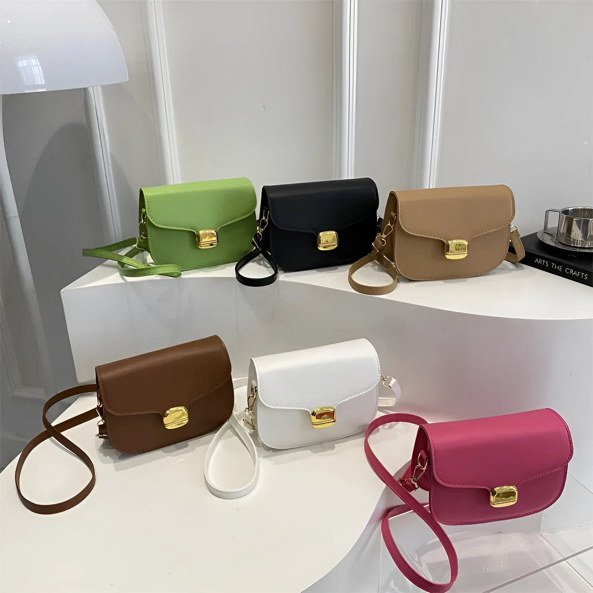 Women's PU leather handbag showing internal zipper pocket and phone compartment in available colours