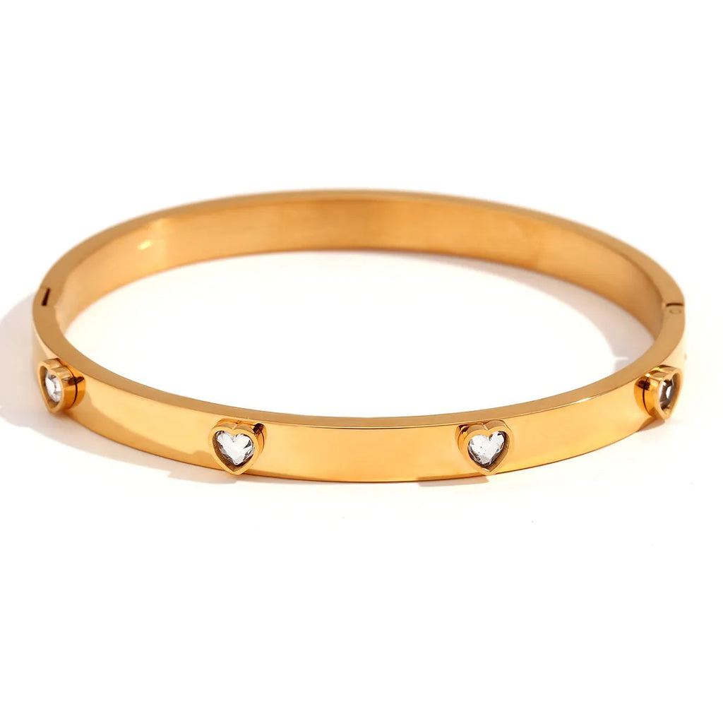 Stainless steel bracelet with a micro-inlaid peach heart charm in a choice of green or white diamond colour.