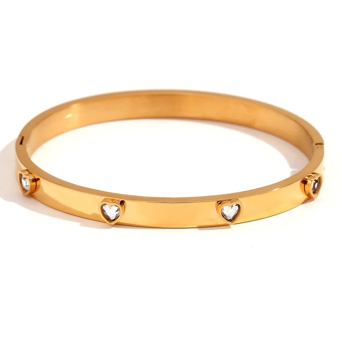 Stainless steel bracelet with a micro-inlaid peach heart charm in a choice of green or white diamond colour.