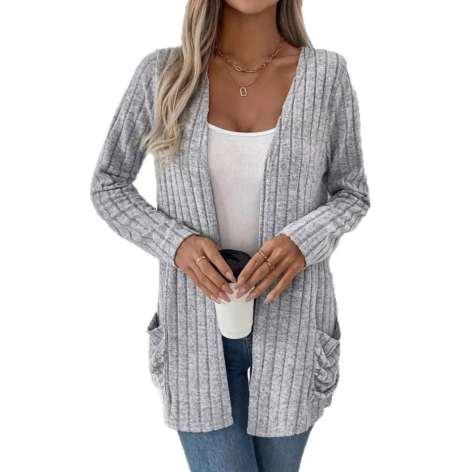 Solid colour long sleeve cardigan knitwear with two pockets, shown in granny grey.
