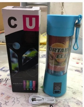 Mini USB electric fruit juicer in pink with stainless steel blade and carry rope