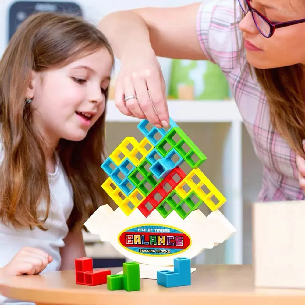 Plastic balance stacking game with 16 coloured blocks on 26.5cm square chassis for family play