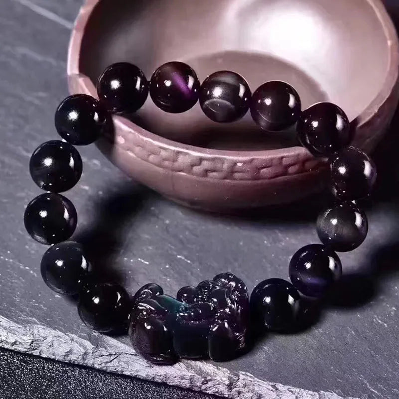 Natural ice colour eye obsidian crystal bracelet with measured beads on wrist