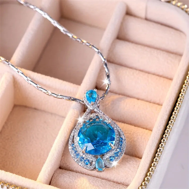 Women's geometric pendant necklace with bright blue fireworks-cut crystal and electroplated water wave chain