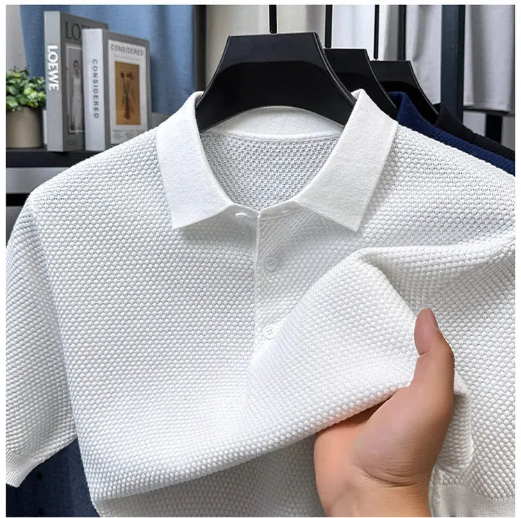 Man wearing a loose navy blue short sleeve cotton pullover sweater casually.