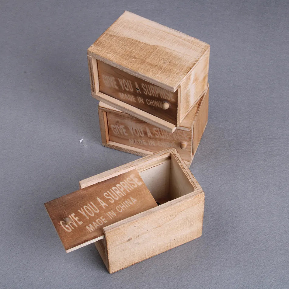 Wooden prank scare box closed, dimensions 9.1cm x 6.1cm x 6.5cm, for April Fools' jokes.