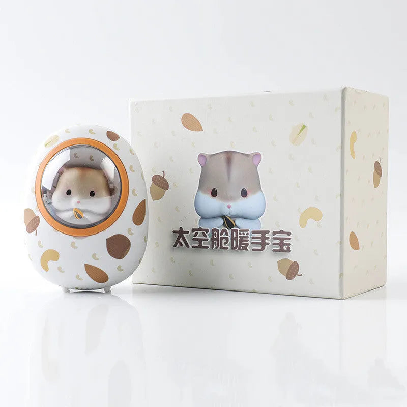 White hamster hand warmer power bank with space capsule design showing heating controls and USB ports