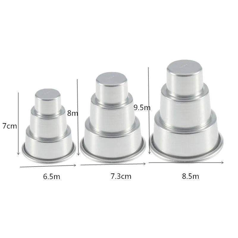 Set of three silver aluminium alloy cake moulds in large, medium, and small sizes.